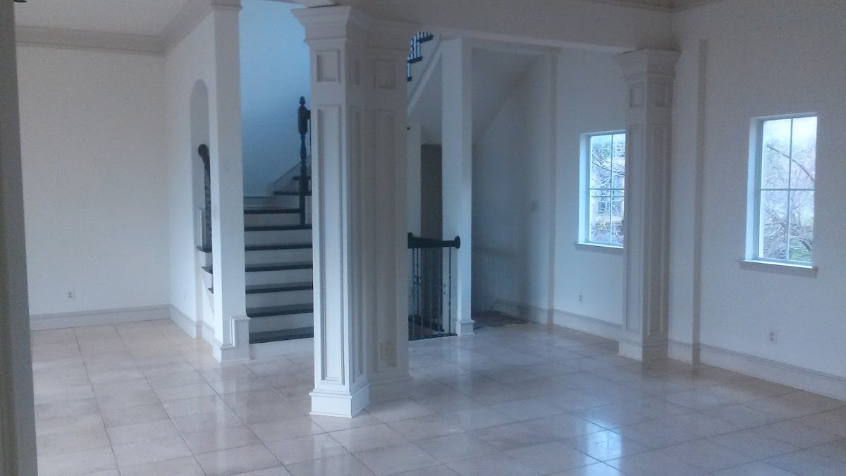Bright interior with freshly painted white walls and decorative columns